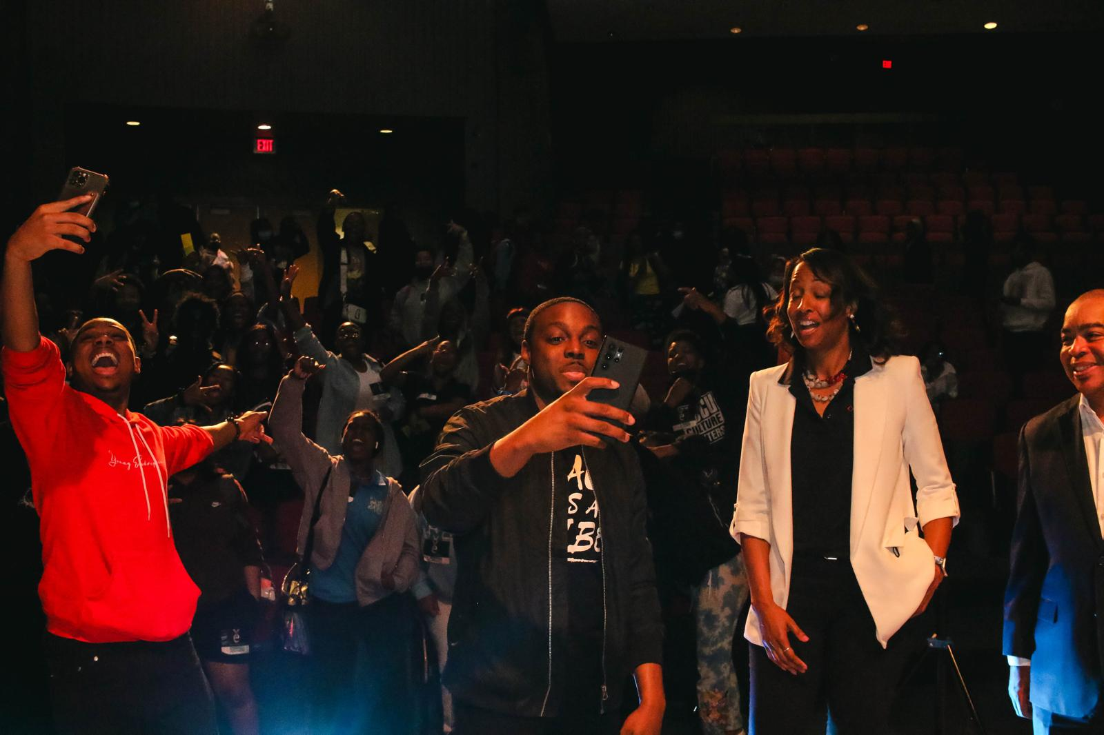 Young entrepreneurs and community leaders celebrating together at a YE event